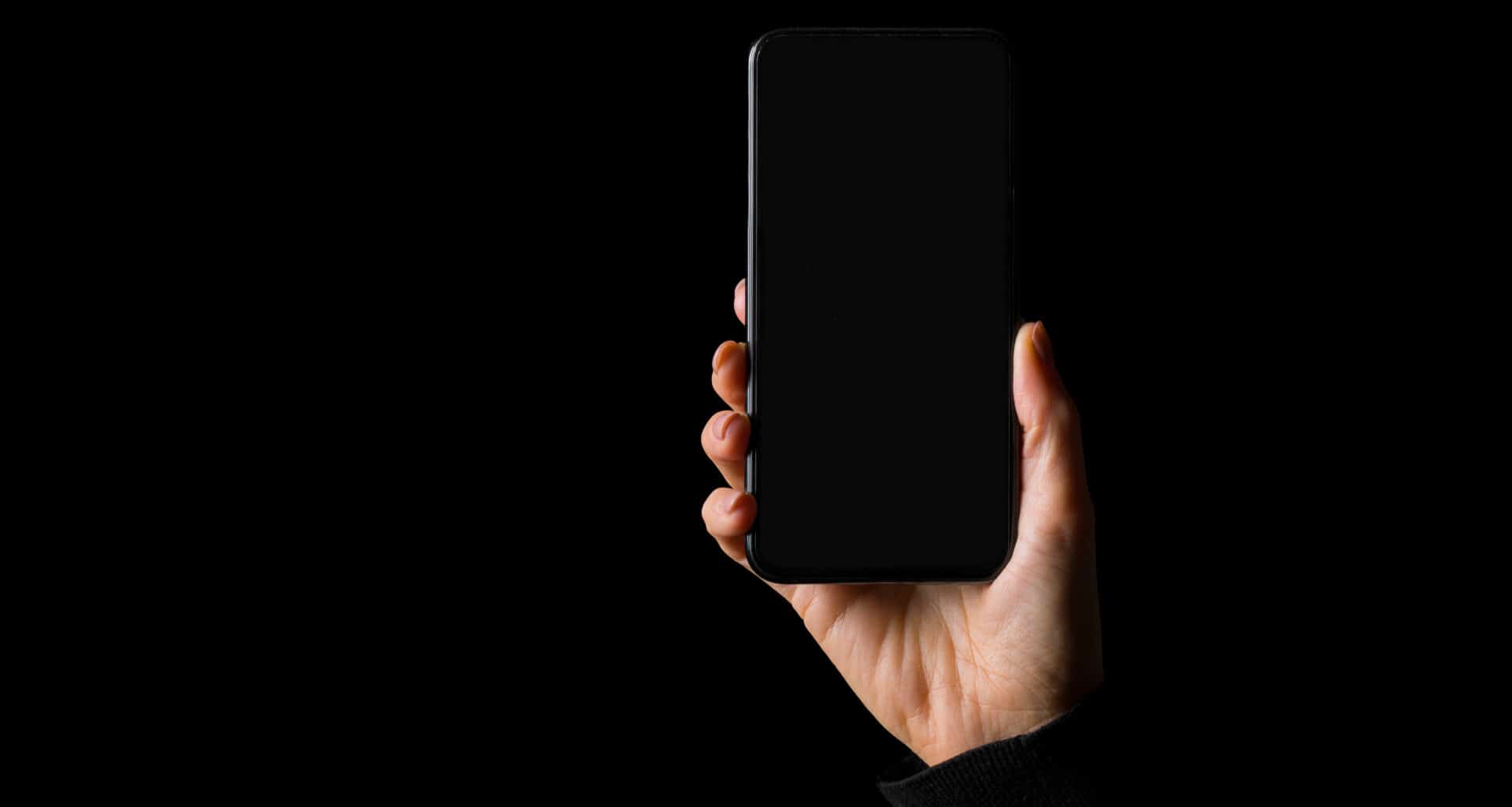 iPhone com tela preta e fundo preto