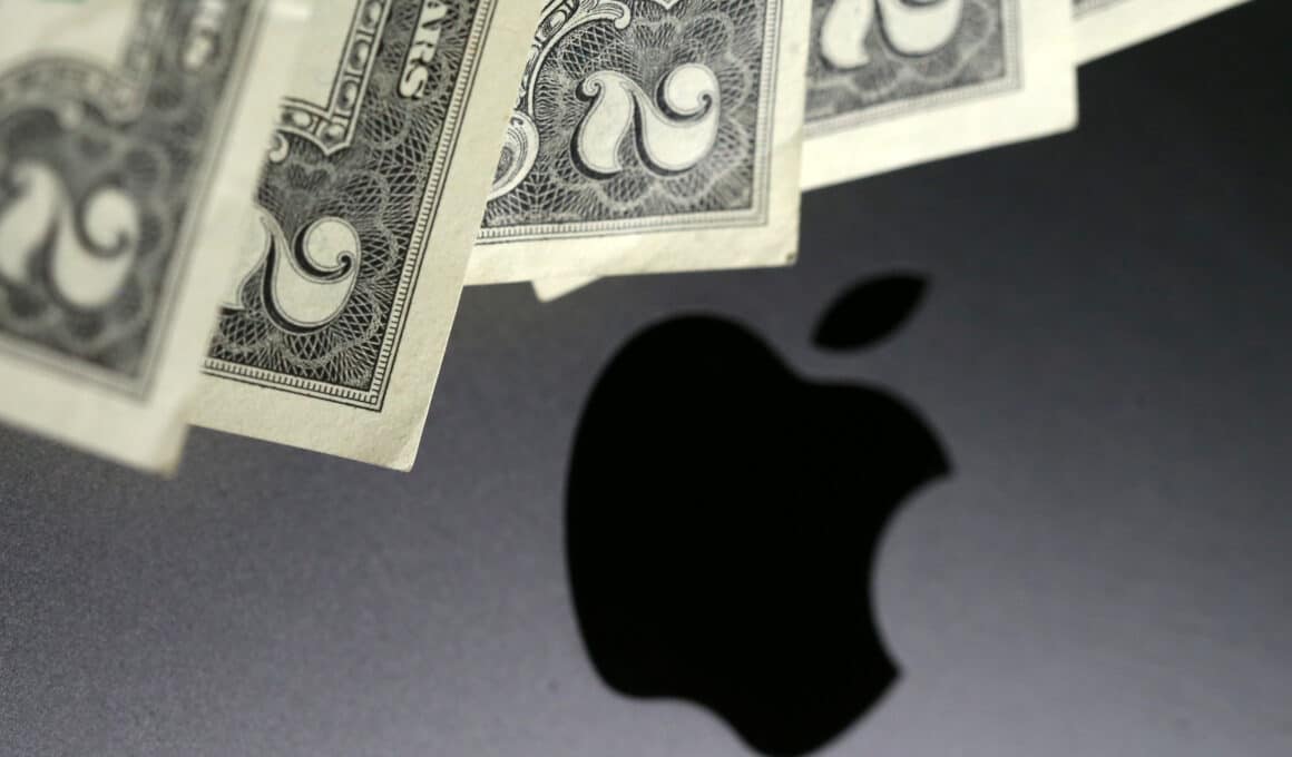 Logo de MacBook com notas de dólares