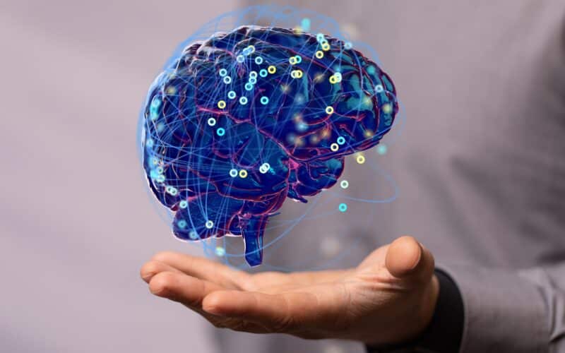 Inteligência artificial (cérebro flutuando sobre uma mão)