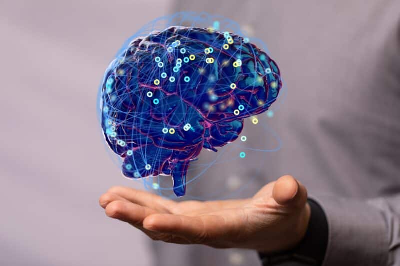 Inteligência artificial (cérebro flutuando sobre uma mão)