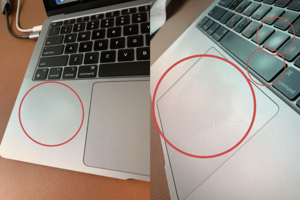 MacBook Air com teclado, trackpad e carcaça desgastados