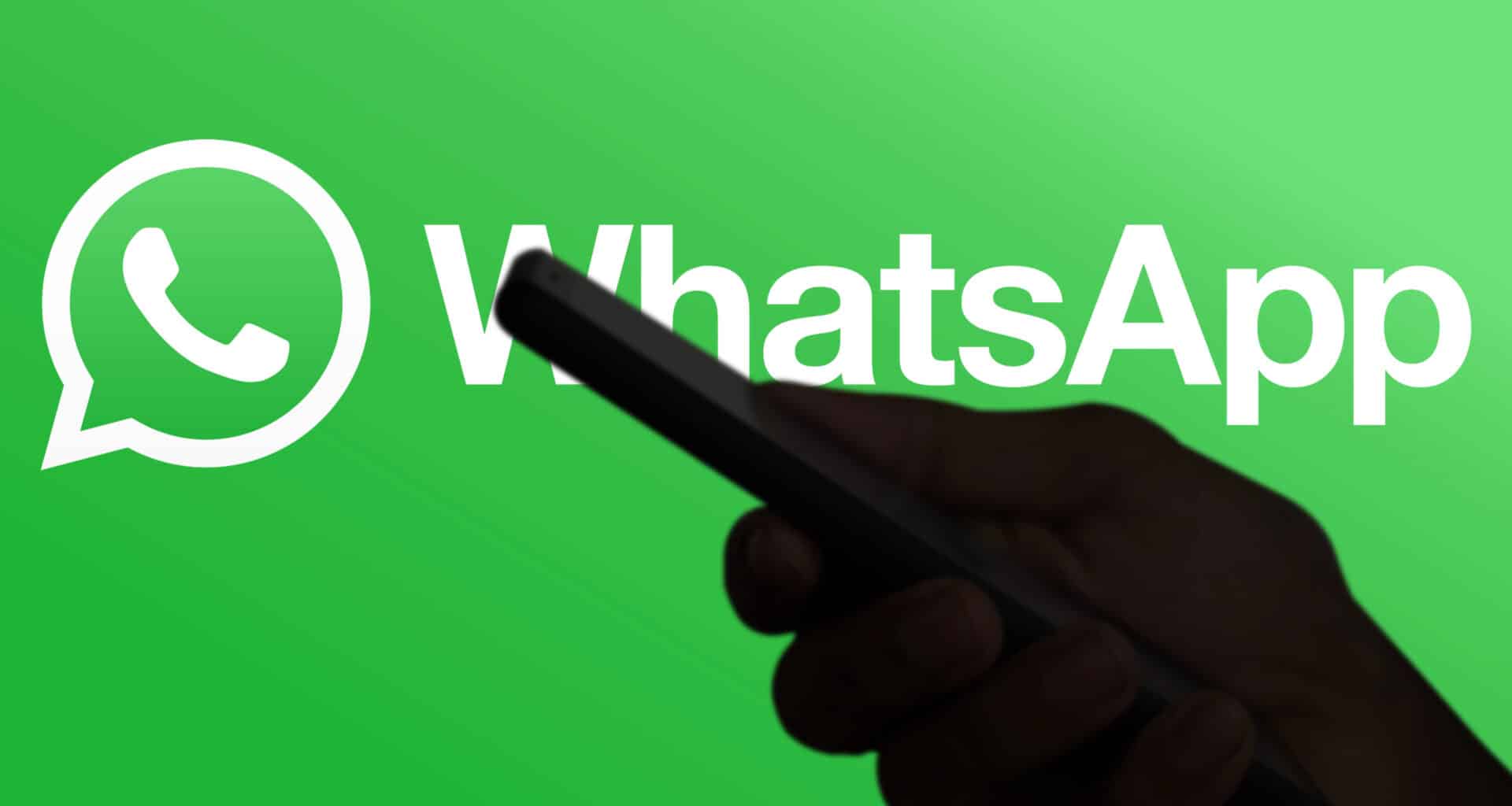 Logo do WhatsApp e uma mão segurando um telefone