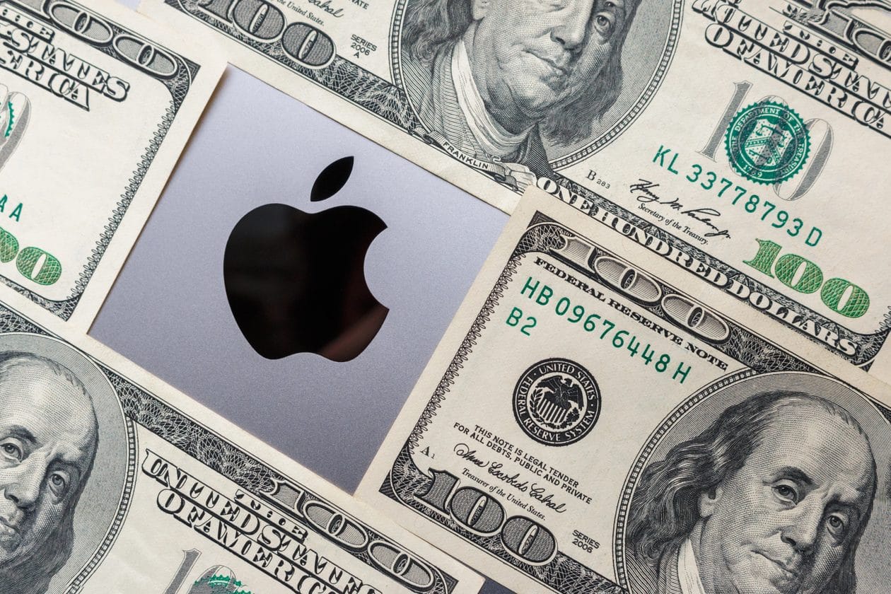 Notas de dinheiro (dólar) em torno do logo da Apple